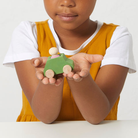 Green wooden car with pink figure - www.toybox.ae
